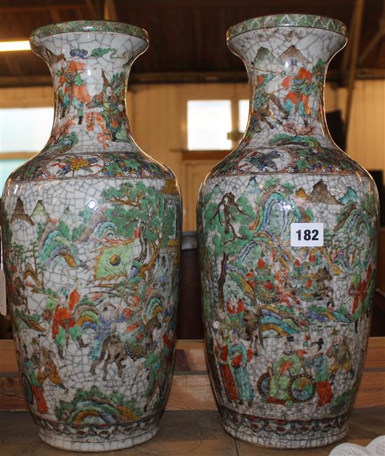 Pair of Chinese polychrome crackle-glazed vases, decorated figures in landscapes